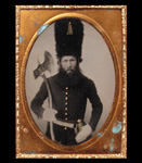Unidentified Union soldier in Sapper's uniform and tall bear skin hat, holding an axe
